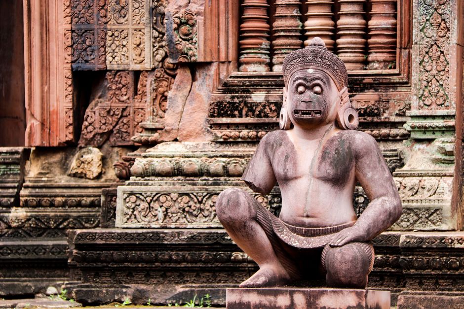 A detailed stone statue at a historic temple, showcasing traditional craftsmanship.