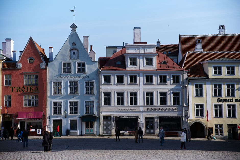 Charming historic buildings in Tallinn's Old Town square, a UNESCO World Heritage site.
