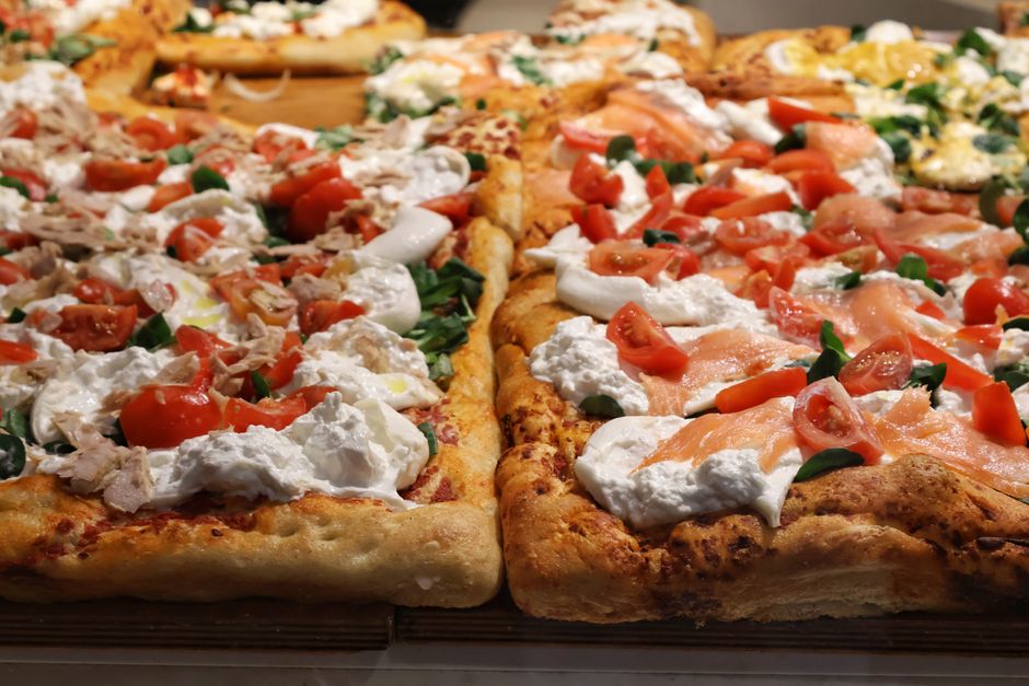 Artisanal pizza with various toppings, capturing the essence of Italian cuisine in Milano.