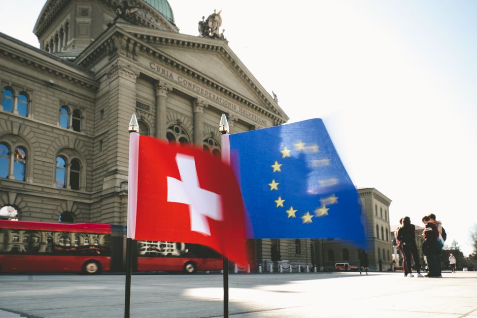 Flags of Switzerland and the EU flutter before the Swiss Federal Palace in Bern.